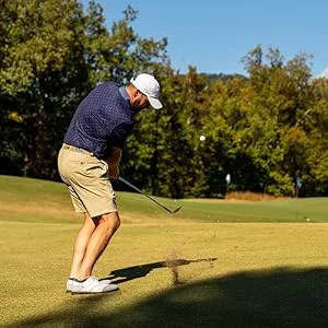 golfer hitting a golf ball