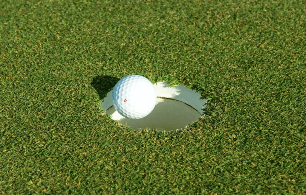 how many golf balls fit in a hole